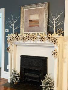 a fireplace with christmas decorations on top of it at Cozy 2B1B Home ｜Walk to BROWN｜RISD｜Pet friendly in Providence