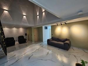 a living room with a couch and a table at Casa Hotel La Bonita in Medellín