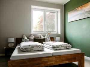 Ένα ή περισσότερα κρεβάτια σε δωμάτιο στο Holiday home Hof Bombüll