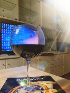 a glass of red wine sitting on a table at Sorrento 319 in Sorrento