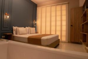 Postel nebo postele na pokoji v ubytování La Casona Hotel Boutique