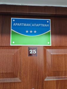 a sign on a door that says aprilventhventh istg at Apartman Basic Doboj in Doboj +6 photos