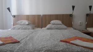Posteľ alebo postele v izbe v ubytovaní Capital Guesthouse Budapest