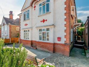 an old brick house with red crosses on it at 1 Bed in Broadstairs 89359 in Broadstairs