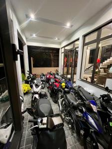 a row of motorcycles parked in a room at SAFFRON Dalat in Da Lat