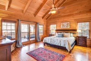 a bedroom with a bed and a ceiling fan at Wooded Cabin Mtn Views, Hot Tub and 2 Decks! in Sapphire +35 photos