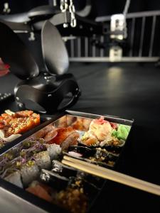 a tray of food on top of a table at World Of Ecstasy - Apartament BDSM in Reda