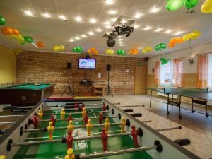 a room with pool tables and ping pong balls at Four -anniversary Type B in Dźwirzyno