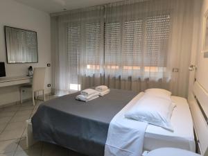 A bed or beds in a room at Tre R