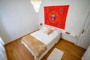 Ένα ή περισσότερα κρεβάτια σε δωμάτιο στο Casa Lula