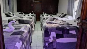 Postel nebo postele na pokoji v ubytování Hotel Kamelot Parque Central