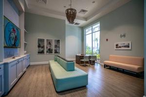a large living room with a couch and a chair at Luxury Living at its Finest in Davenport, FL in Davenport