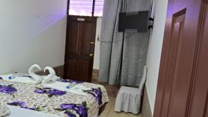 Postel nebo postele na pokoji v ubytování Hotel Kamelot Parque Central