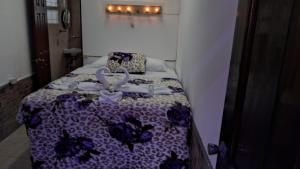 Postel nebo postele na pokoji v ubytování Hotel Kamelot Parque Central