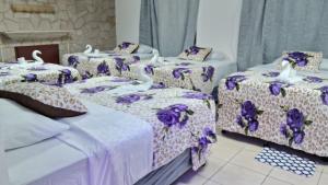 Postel nebo postele na pokoji v ubytování Hotel Kamelot Parque Central