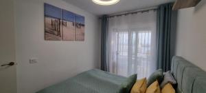 a living room with a couch and a window at Oceanfront Villa - Tenerife South in San Miguel de Abona +30 photos