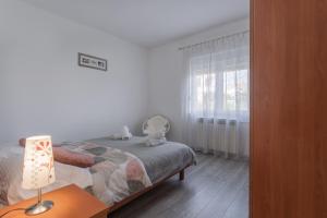 Posteľ alebo postele v izbe v ubytovaní Apartman Lana Vidikovac