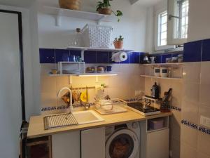 a kitchen with a washing machine in a room at Casa Mamma Mia in Albori +38 photos