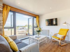 a living room with a couch and a table at 1 Bed in Weston-Super-Mare 78986 in Weston-super-Mare