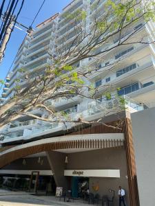 a tall building with a tree on top of it at Dominique Cartagena, Beautiful 2 Bedroom Apartment in Cartagena de Indias