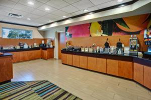 a lobby of a restaurant with a counter and a bar at Fairfield Inn & Suites by Marriott Lexington North in Lexington