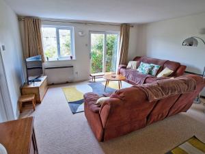 a living room with a couch and a television at 3 Bed in Narberth FB138 in Narberth