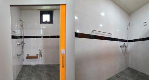 a bathroom with a walk in shower and a walk in shower at Starium Seocheon in Seocheon