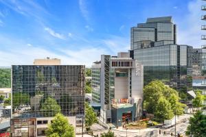 an aerial view of a city with tall buildings at Lenox Mall Buckhead City Views in Atlanta