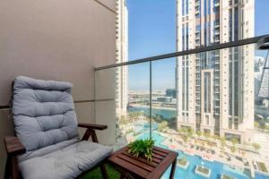 a living room with a couch and a large window at Apartament Great view Dubai in Dubai