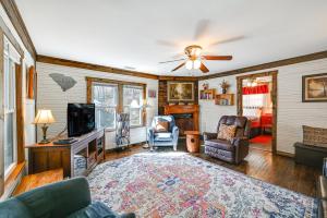 a living room with a ceiling fan and a tv at Cleveland Home with South Saluda Fishing Access in Cleveland