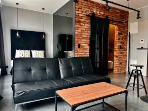Posedenie v ubytovaní Loft Apartment Browary Warszawskie