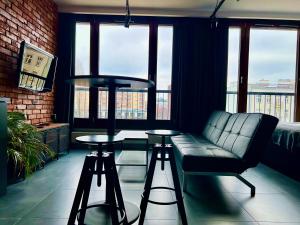 Posedenie v ubytovaní Loft Apartment Browary Warszawskie