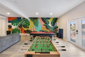 a game room with a pool table and billards at Palm Cove Motel in Clearwater