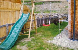 a playground with slides and swings in a yard at Stunning Home In Schnberg Lachtal With 5 Bedrooms, Sauna And Wifi in Lachtal