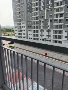 a balcony with a view of tall buildings at Homestay Melody Puncak Alam in Bandar Puncak Alam