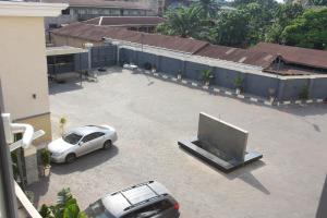 a car parked in a parking lot with a tv at Grand Seasons Hotel, Nnewichi in Nnewi