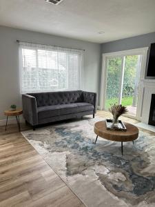 a living room with a couch and a table at The Cozy Nook in Fair Oaks