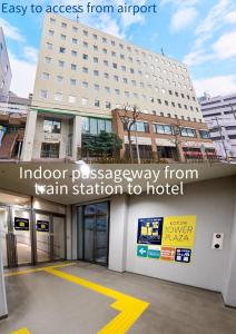 a hotel entrance with the words indoor possessionaway from train station to hotel at Kotoni Green Hotel in Sapporo