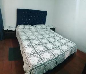 Postel nebo postele na pokoji v ubytování Hostal Perla Del Norte