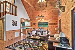 a living room with a couch and a table at NEW HOT TUB! Secluded 3 Bed Cabin in Pigeon Forge in Pigeon Forge