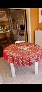 a table with a red table cloth on it at Tenerife Royal Garden in Playa de las Americas