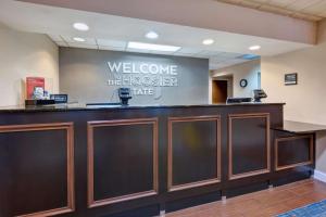 a welcome to the hoeoser take sign on a dental office counter at Hampton Inn Princeton in Princeton