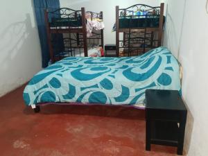 Postel nebo postele na pokoji v ubytování Hostal Perla Del Norte