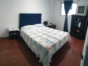 Postel nebo postele na pokoji v ubytování Hostal Perla Del Norte