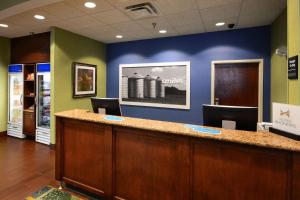 a lobby with a reception desk in a hospital at Hampton Inn Roxboro in Roxboro