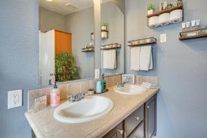 a bathroom with two sinks and a mirror at Covered Patio Lincoln Vacation Rental! in Lincoln +25 photos