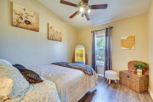 a bedroom with a bed and a ceiling fan at Lincoln Vacation Rental with Private Fire Pit! in Lincoln