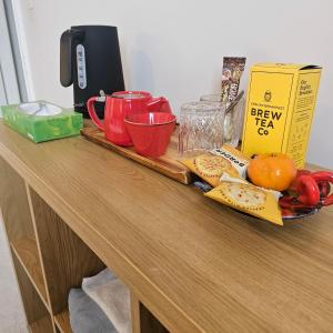 a wooden counter with a table with food on it at Shrewsbury in Manchester +19 photos