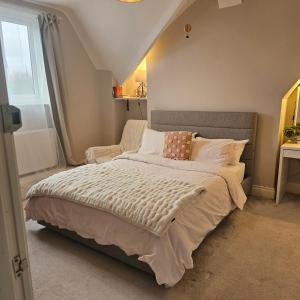 a bedroom with a large bed and a window at Shrewsbury in Manchester