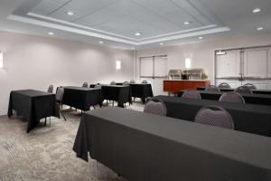 a conference room with tables and chairs and a podium at Hilton Garden Inn Los Angeles Marina Del Rey in Los Angeles +28 photos